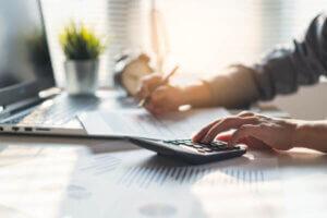 Woman reviewing tax statement after settling her debt